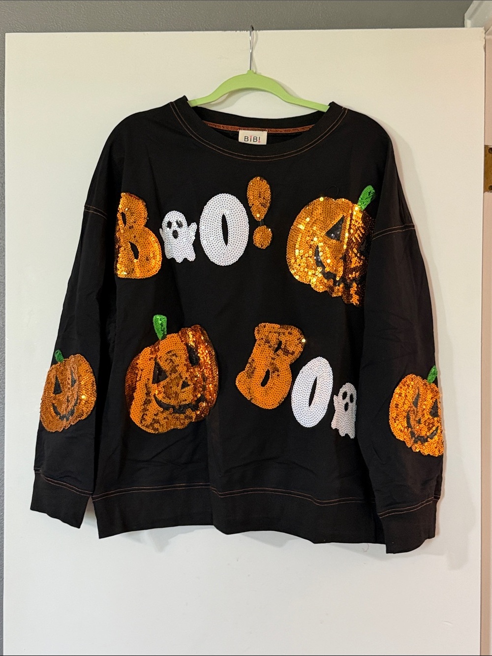 BiBi Black Long Sleeve Sweatshirt with Orange Sequin Pumpkins and White 'BOO'